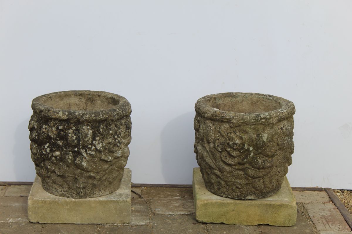 Pair of round stone planters with floral design - Image 4