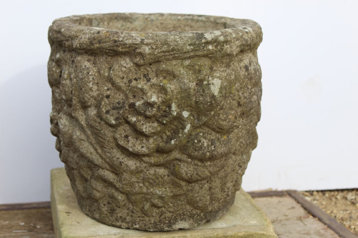 Pair of round stone planters with floral design - Image 2